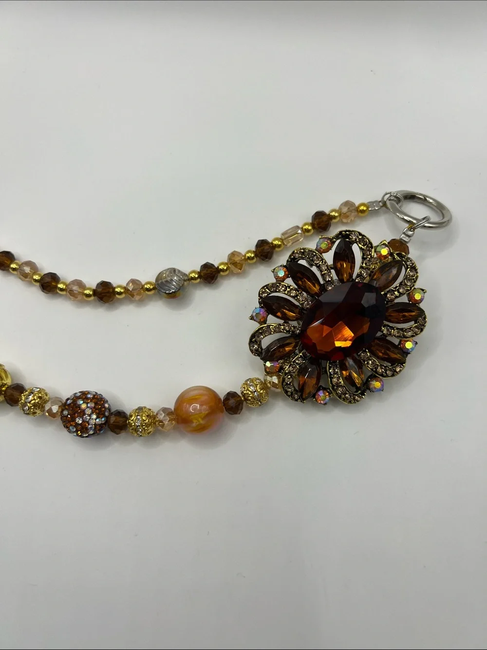 745. Vintage-Inspired Amber Beaded Bag Chain with Floral Accent